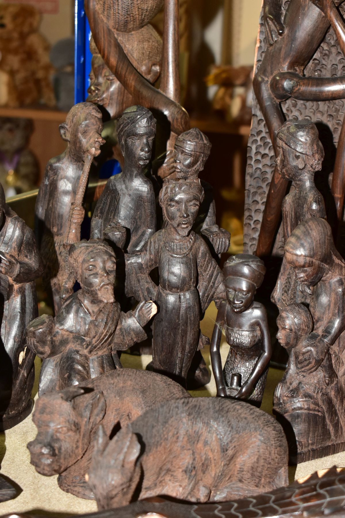 A GROUP OF CARVED HARDWOOD AFRICAN FIGURES, to include a nativity set from Dar-es-Salaam, - Image 8 of 16