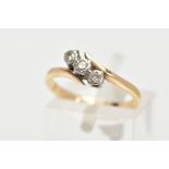 A THREE STONE DIAMOND RING, three round brilliant cut diamonds in a white metal setting, with a