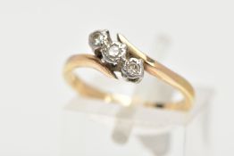 A THREE STONE DIAMOND RING, three round brilliant cut diamonds in a white metal setting, with a