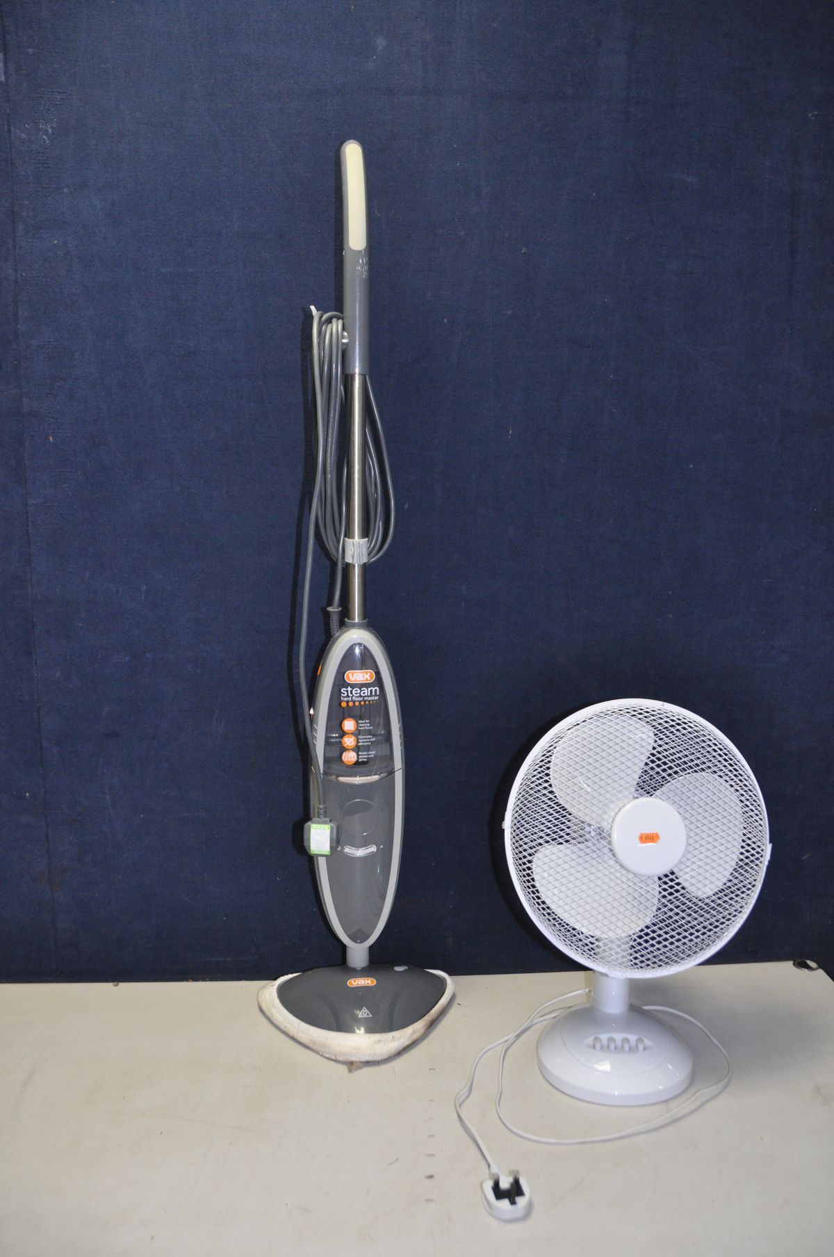 A VAX HARD FLOOR MASTER STEAM CLEANER and a Challenge desk fan (both PAT pass and working)