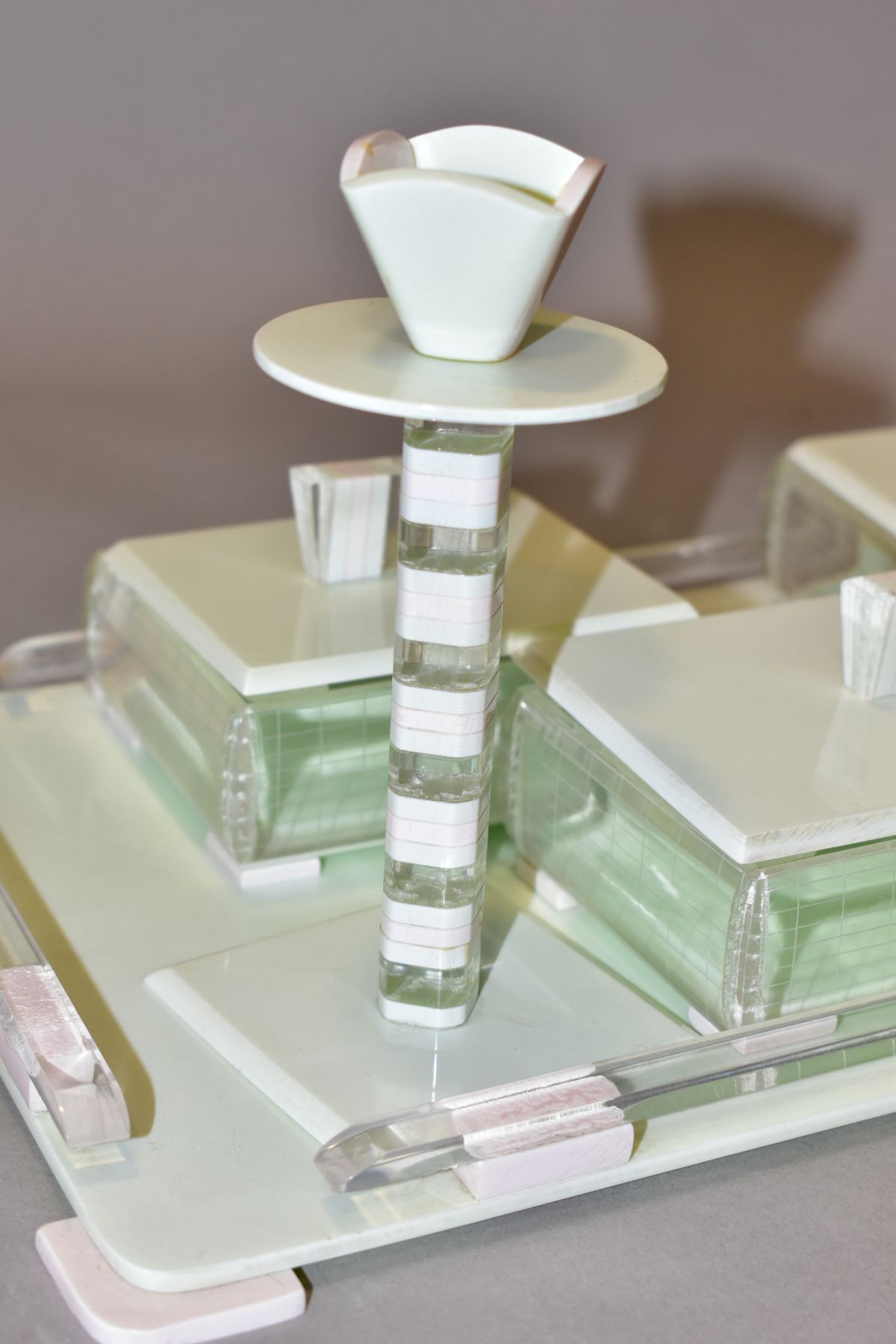 AN ART DECO PINK, GREEN AND CLEAR PLASTIC DRESSING TABLE SET, comprising rectangular tray, a pair of - Image 5 of 12