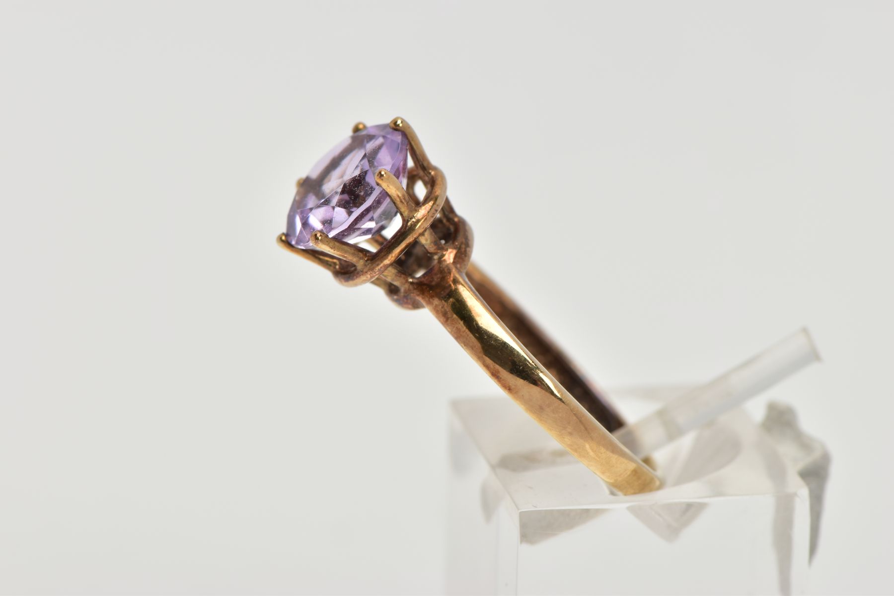 A AMETHYST SOLITAIRE RING, a circular cut amethyst, approximate diameter 9mm, set in a yellow - Image 2 of 4