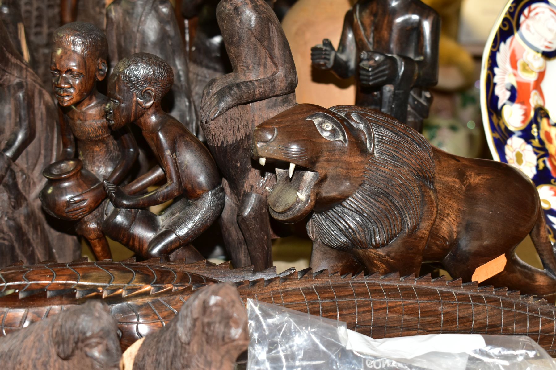 A GROUP OF CARVED HARDWOOD AFRICAN FIGURES, to include a nativity set from Dar-es-Salaam, - Image 11 of 16