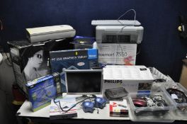 A QUANTITY OF COMPUTER EQUIPMENT including a new iCute PC case in box, a New in box Linksys Modem,