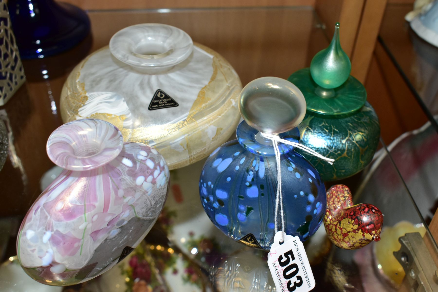 FIVE PIECES OF ISLE OF WIGHT GLASS, comprising a red and gilt bird, label to base, chipped beak, - Image 6 of 6