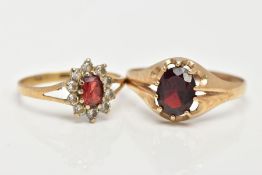 TWO 9CT GOLD GARNET RINGS, the first of an oval design set with an oval cut garnet within a ten claw