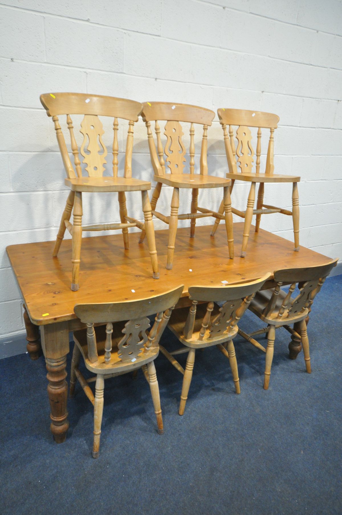 A PINE 6FT TABLE, on turned legs, length 183cm x depth 92cm x height 77cm, and six beech chairs (7)