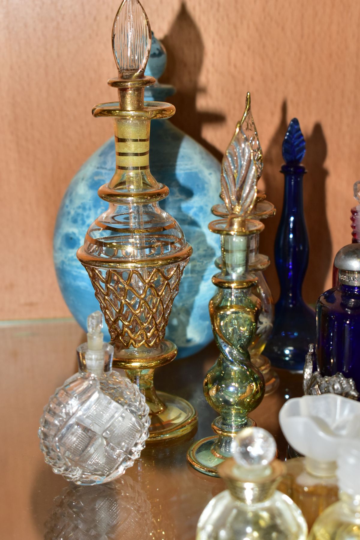 A COLLECTION OF 19TH AND 20TH CENTURY PERFUME BOTTLES , SPARE STOPPERS AND A FUNNEL, mostly glass, - Image 12 of 16