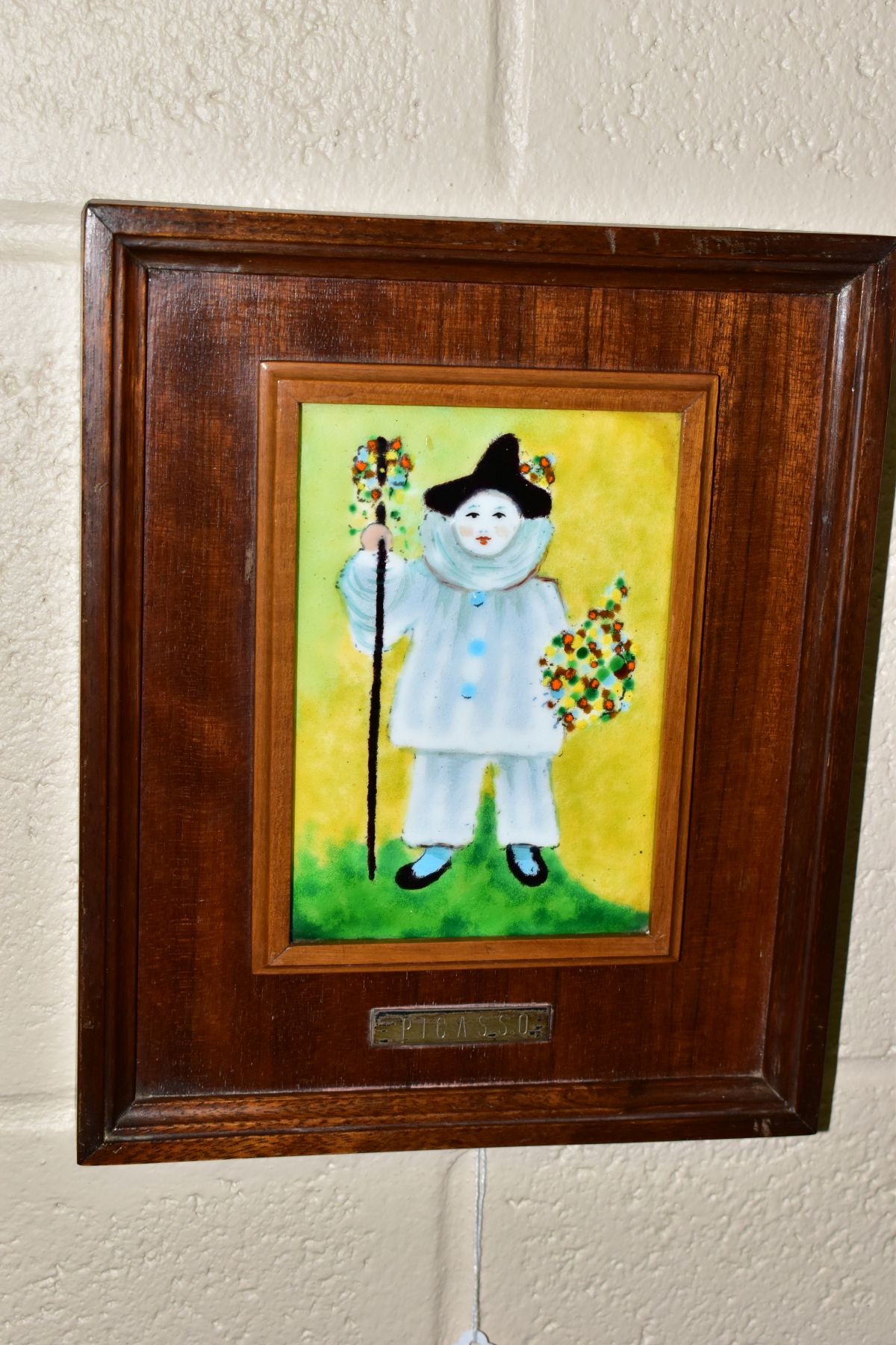 AFTER PABLO PICASSO 'PAUL AS PIERROT', a wood framed enamel plaque depicting the artists son dressed - Image 3 of 4