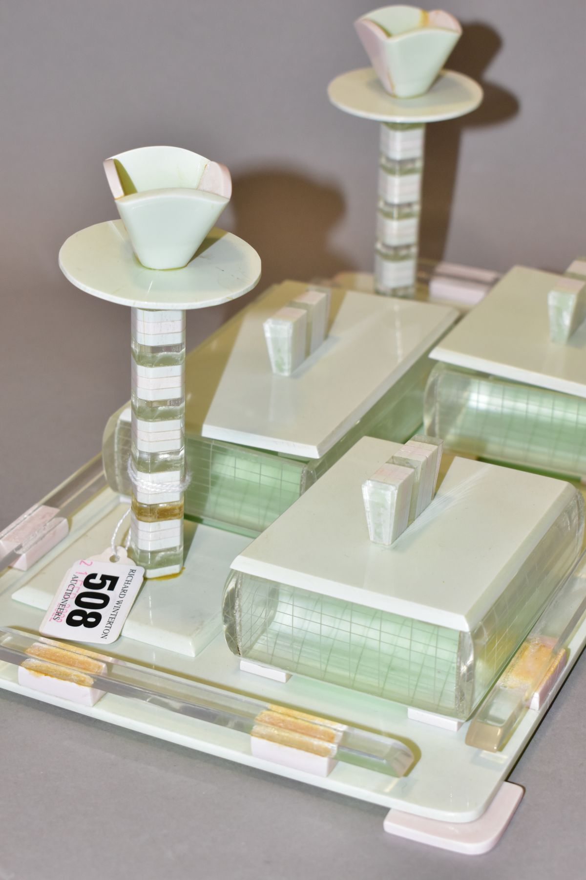 AN ART DECO PINK, GREEN AND CLEAR PLASTIC DRESSING TABLE SET, comprising rectangular tray, a pair of - Image 3 of 12