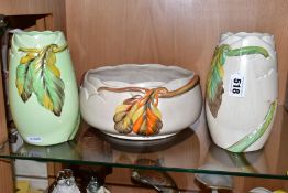 THREE PIECES OF CLARICE CLIFF NEWPORT POTTERY IN THE AUTUMN LEAF PATTERN, comprising two vases,