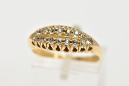 AN 18CT GOLD DIAMOND BOAT RING, a yellow gold ring set with sixteen old cut diamonds, leading onto a