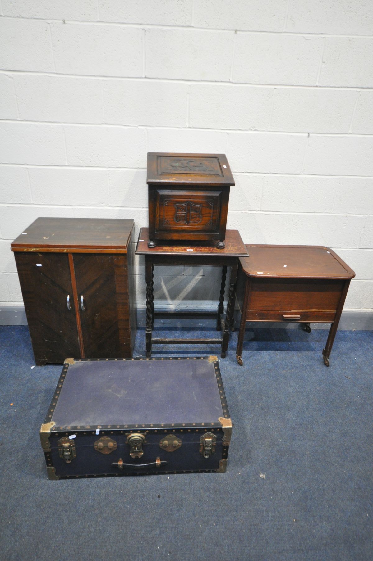 A VINTAGE TRAVELLING SUITCASE, mahogany sewing box, mahogany cased treadle sewing machine/cabinet,