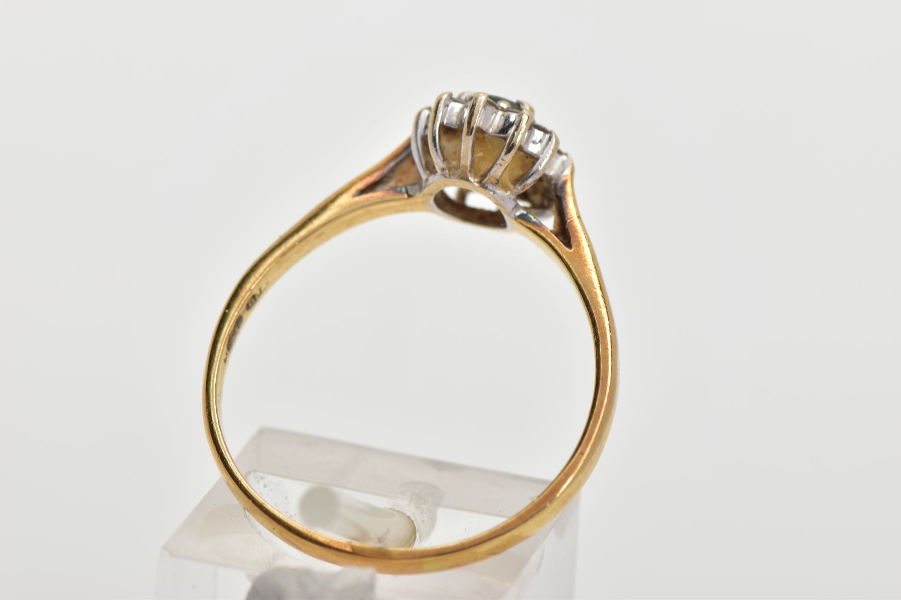 AN 18CT GOLD GEM SET CLUSTER RING, of an oval form, centring on an oval cut aquamarine, within a - Image 3 of 4
