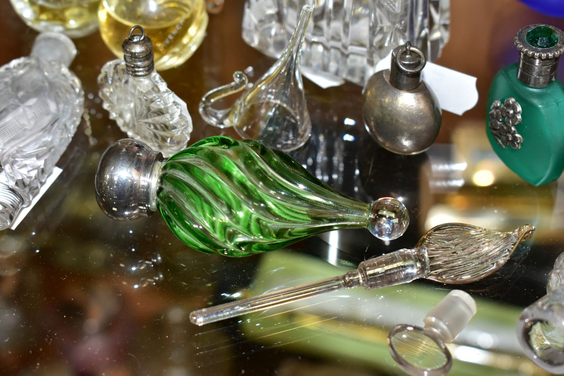 A COLLECTION OF 19TH AND 20TH CENTURY PERFUME BOTTLES , SPARE STOPPERS AND A FUNNEL, mostly glass, - Image 14 of 16