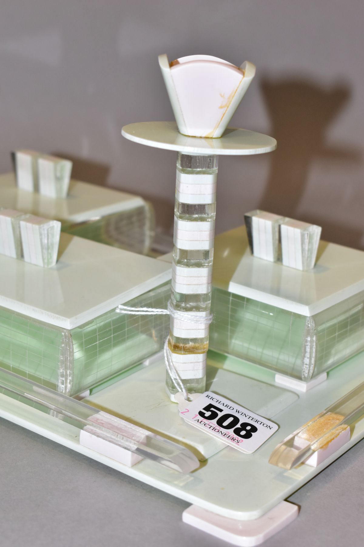 AN ART DECO PINK, GREEN AND CLEAR PLASTIC DRESSING TABLE SET, comprising rectangular tray, a pair of - Image 4 of 12