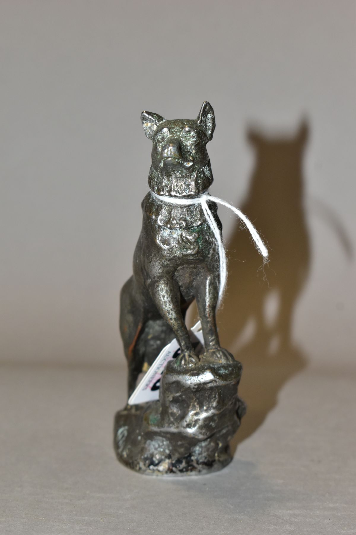 A CHROMED METAL CAR MASCOT IN THE FORM OF AN ALSATIAN STANDING WITH ITS FRONT LEGS ON A ROCK, - Image 2 of 6