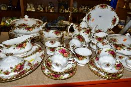 A FIFTY PIECE ROYAL ALBERT OLD COUNTRY ROSES DINNER SERVICE, comprising a teapot, a sugar bowl, a
