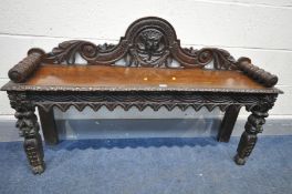 A 19TH CENTURY CARVED OAK HALL BENCH, with a raised back, bobbin turned arms, length 121cm x depth