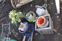 A VINTAGE GALVANISED WATERING CAN and seventeen plant pots including two square composite pots