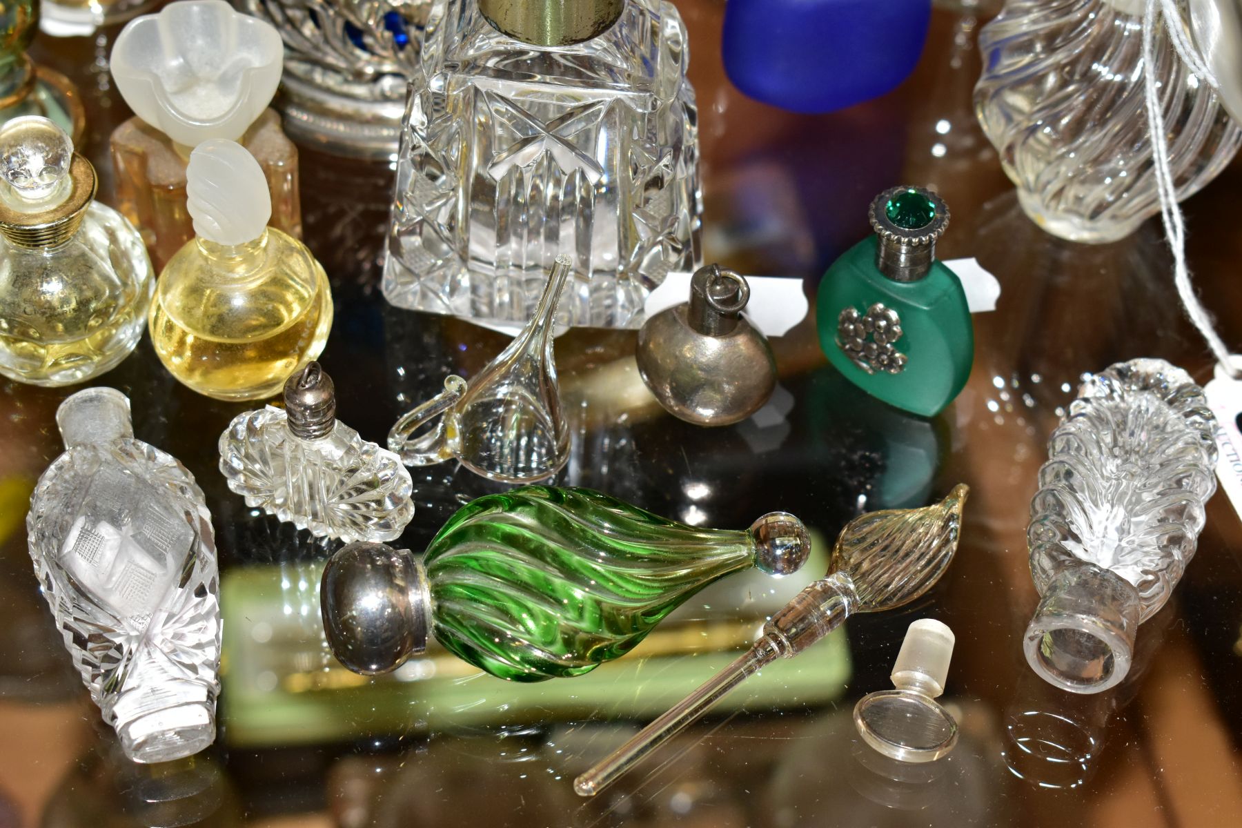 A COLLECTION OF 19TH AND 20TH CENTURY PERFUME BOTTLES , SPARE STOPPERS AND A FUNNEL, mostly glass, - Image 2 of 16