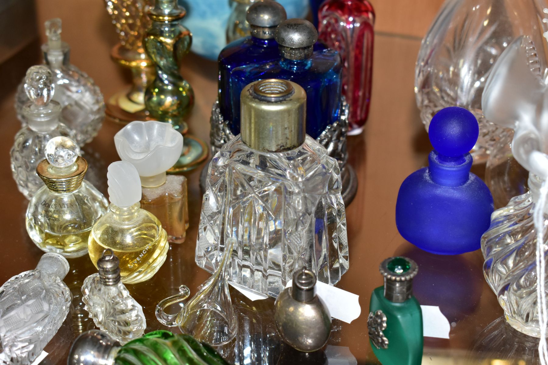 A COLLECTION OF 19TH AND 20TH CENTURY PERFUME BOTTLES , SPARE STOPPERS AND A FUNNEL, mostly glass, - Image 13 of 16