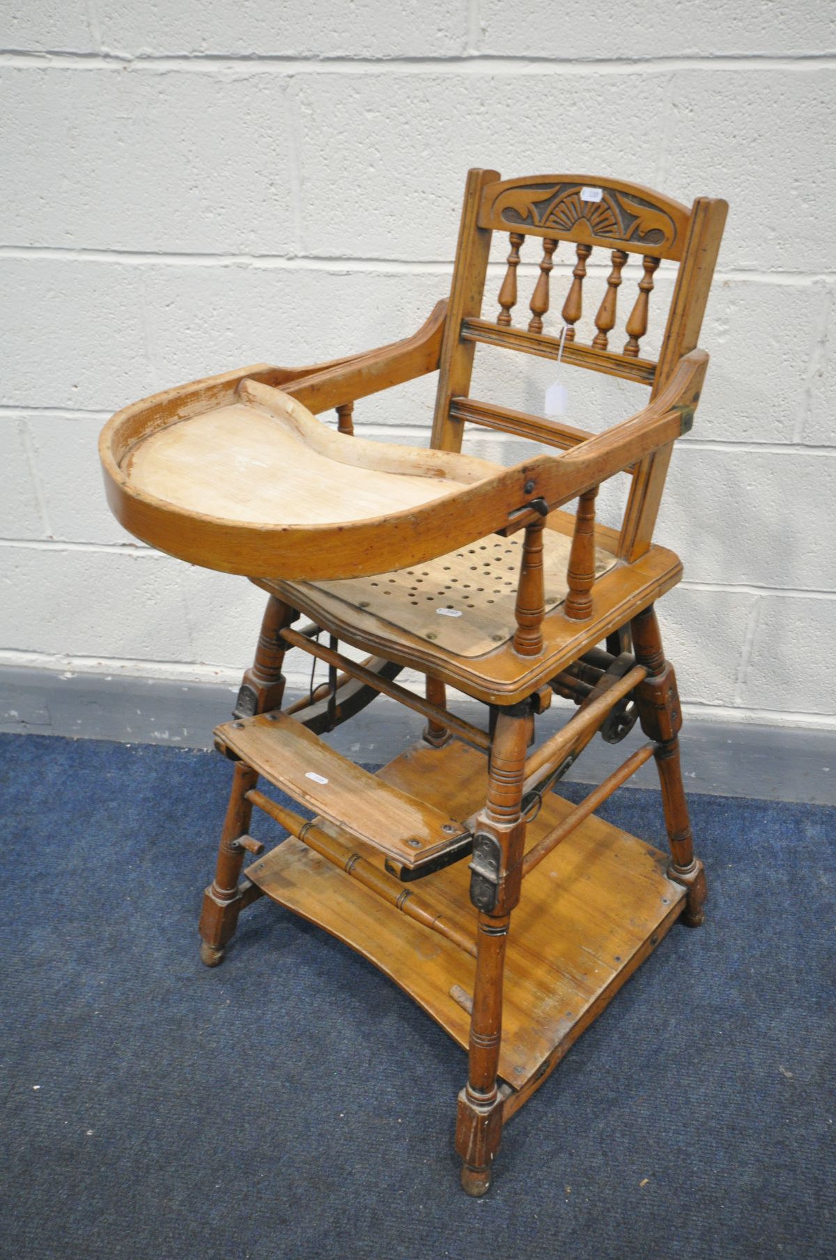 AN EDWARDIAN WALNUT METAMORPHIC HIGH CHAIR (condition:-wear to finish)