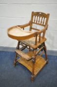 AN EDWARDIAN WALNUT METAMORPHIC HIGH CHAIR (condition:-wear to finish)