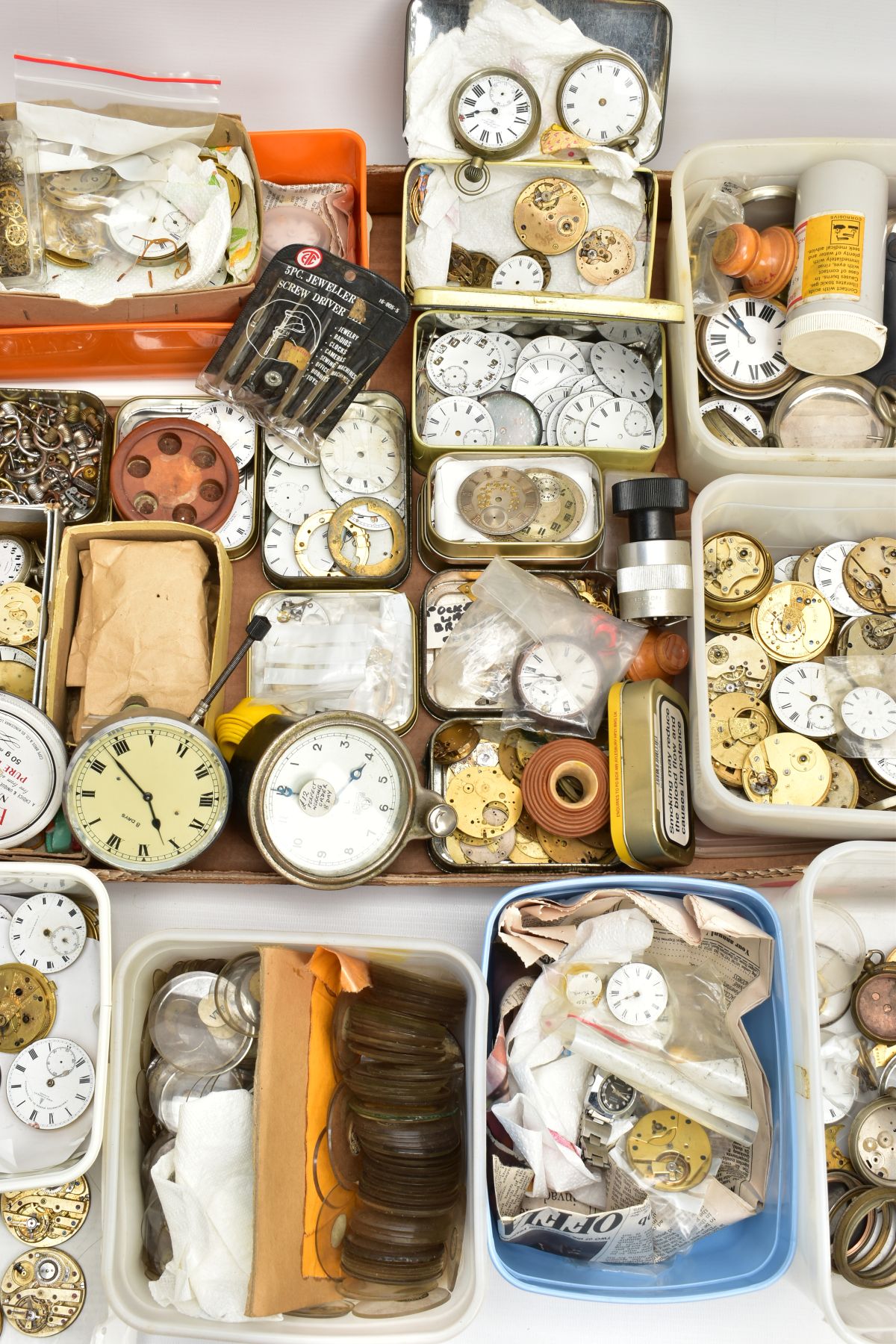 A BOX OF WATCH MAKERS SPARES AND REPAIRS, to include pocket watch dials, cases, movements, a box