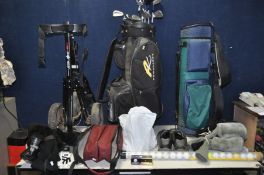 A COLLECTION OF GOLFING EQUIPMENT including a Powakaddy golf bag containing 10 clubs by Titleist and