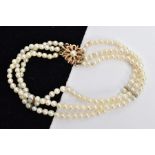 A CULTURED PEARL BRACELET, a three row cultured pearl bracelet, approximate pearl diameter 3mm,