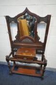 AN EDWARDIAN MAHOGANY HALL STAND, with a central bevelled mirror, four brass hooks and a single