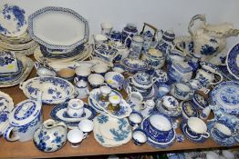 A QUANTITY OF BLUE AND WHITE CERAMIC WARES, mainly transfer printed, approximately one hundred and