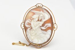 A SHELL CAMEO BROOCH, an oval shell cameo depicting the Grecian goddess Hebe with an eagle,