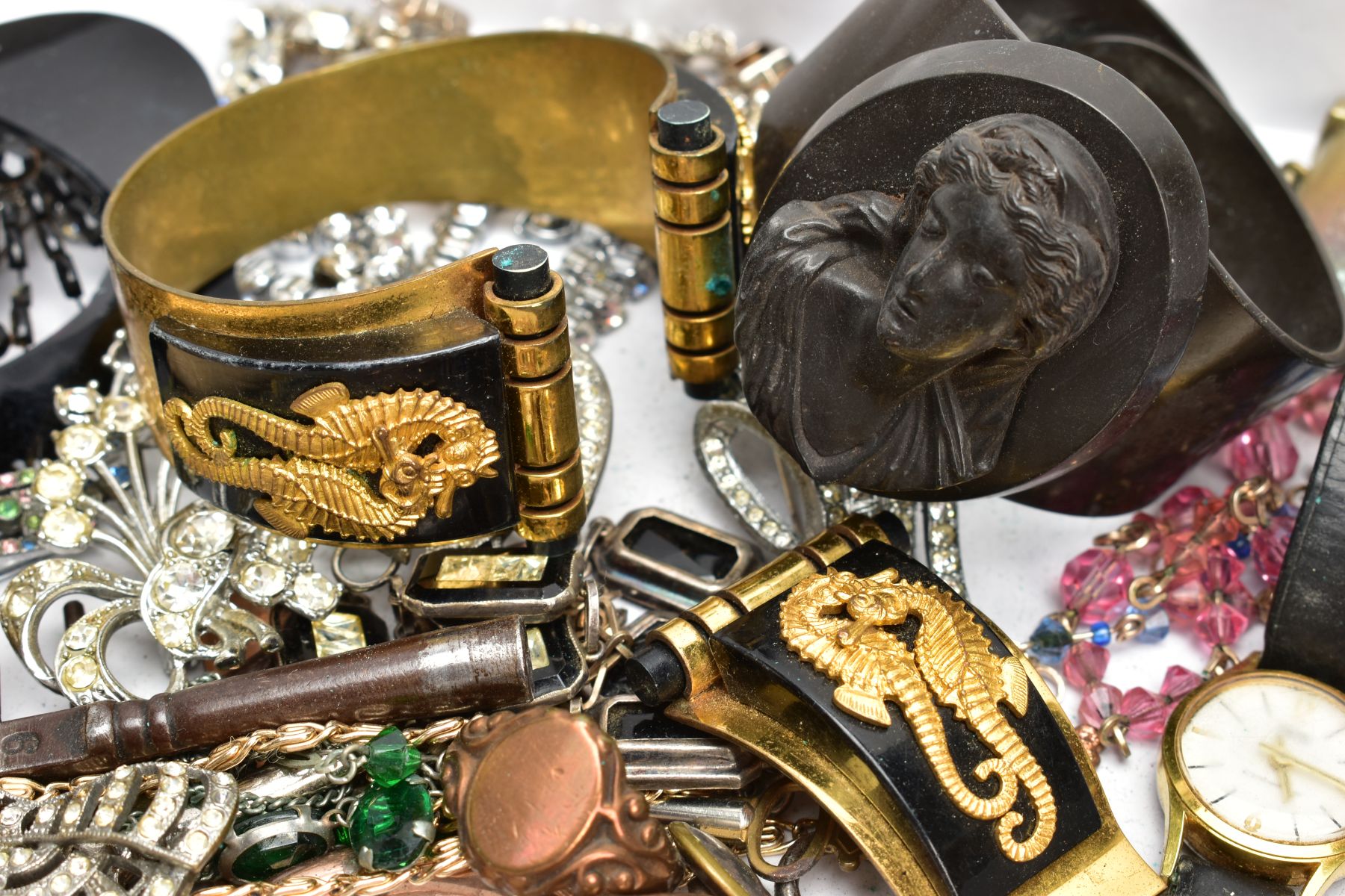 A SELECTION OF COSTUME JEWELLERY, to include a high relief vulcanite cameo bangle, two early to - Image 6 of 6