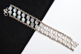 A WHITE METAL MOONSTONE BRACELET, designed with two rows of oval cabochon moonstones each collet