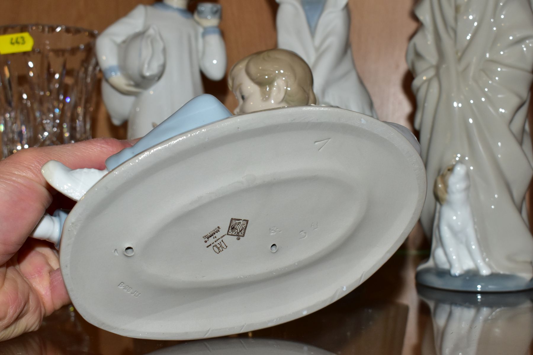 FOUR NAO PORCELAIN FIGURES OF CHILDREN, comprising boy lying down playing with a dog, possibly - Image 3 of 8