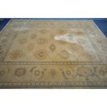 A LARGE GOLD UPHOLSTERED CARPET SQUARE, 366cm x 274cm (condition:-stain to centre of rug)