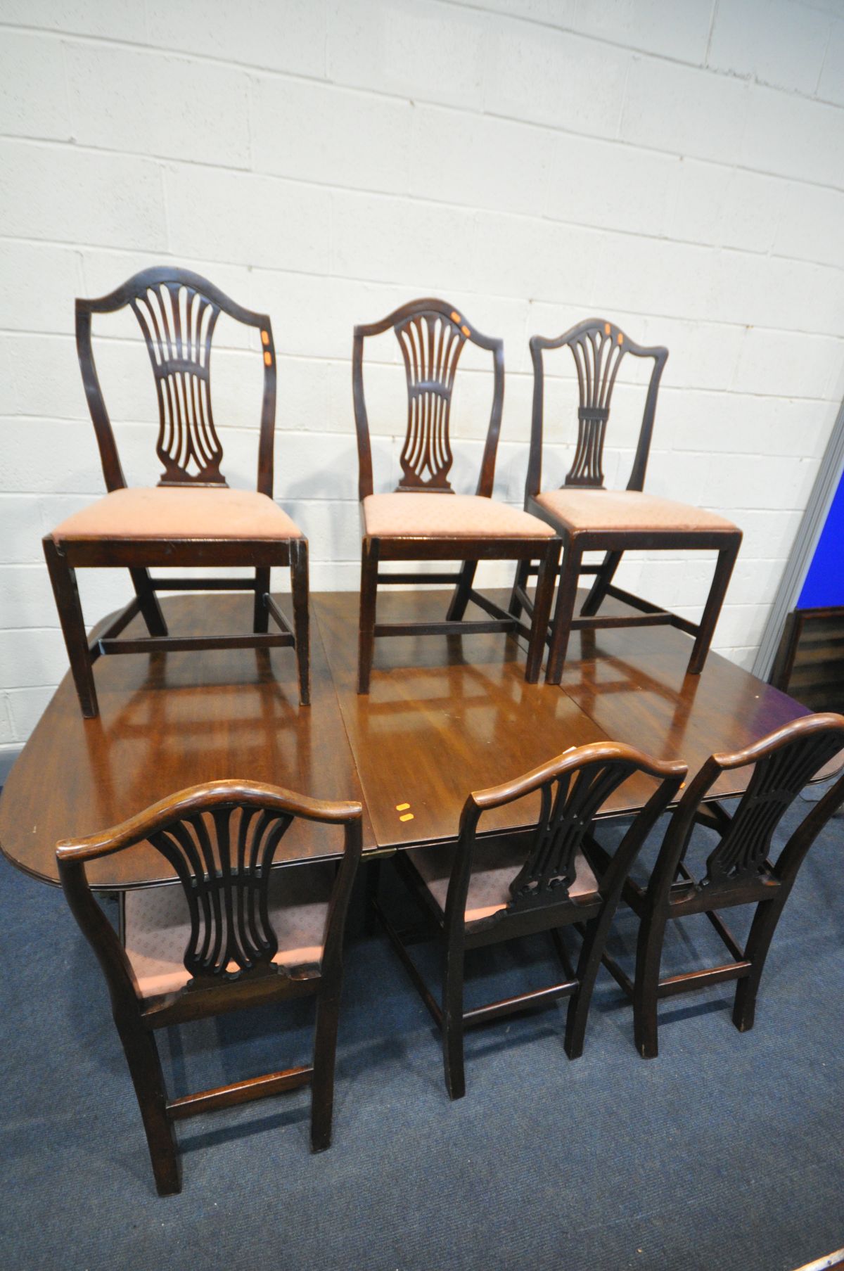 A GEORGIAN MAHOGANY TWIN PEDESTAL DINING TABLE, with one additional leaf, extended length 192cm x