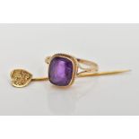 A 9CT GOLD AMETHYST RING AND A STICK PIN, the ring designed with a cushion cut amethyst, collet