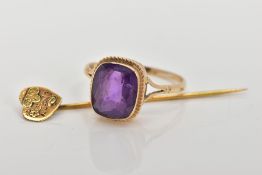 A 9CT GOLD AMETHYST RING AND A STICK PIN, the ring designed with a cushion cut amethyst, collet