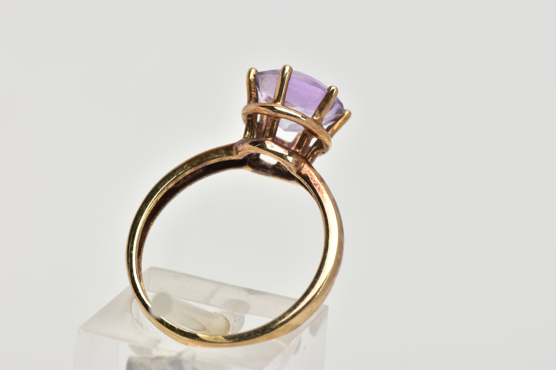 A AMETHYST SOLITAIRE RING, a circular cut amethyst, approximate diameter 9mm, set in a yellow - Image 3 of 4