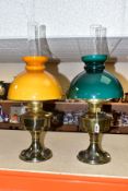 TWO ALADDIN NO 23 OIL LAMPS, with amber and green glass shades and clear chimneys (one original