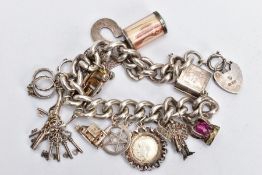 A SILVER CHARM BRACELET AND CHARMS, a thick curb link bracelet, fitted with spring clasp and a heart