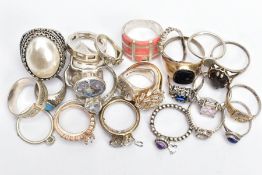 AN ASSORTMENT OF SILVER AND WHITE METAL RINGS, to include an oval cut smokey quartz set into a