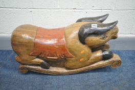 A DECORATIVE HARDWOOD CHILDS ROCKING TOY, of a pig