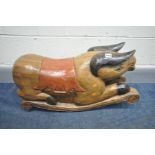 A DECORATIVE HARDWOOD CHILDS ROCKING TOY, of a pig