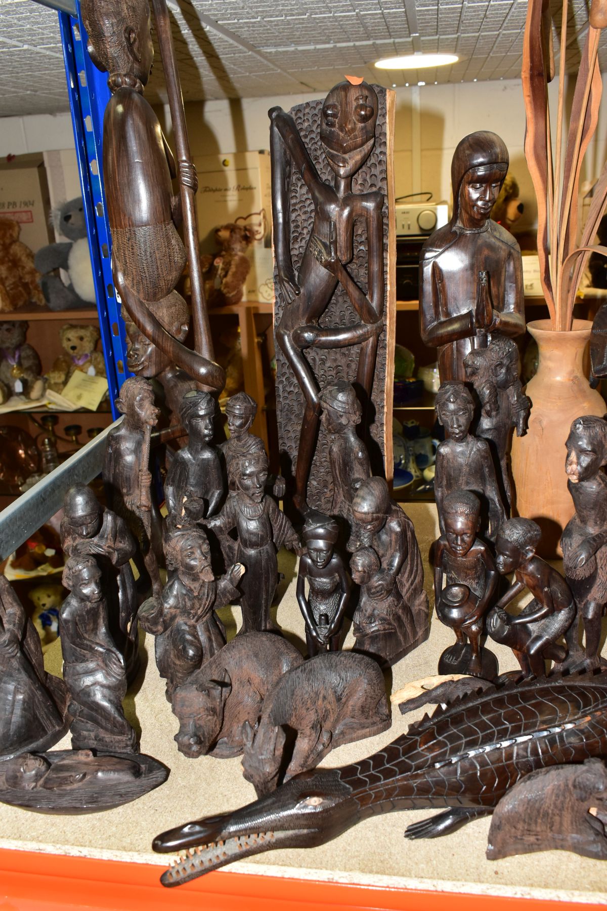 A GROUP OF CARVED HARDWOOD AFRICAN FIGURES, to include a nativity set from Dar-es-Salaam,