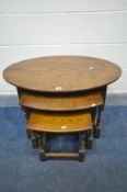 AN OLD CHARM OAK OVAL TOP NEST OF THREE TABLES, largest table width 82cm x depth 56cm x height