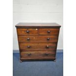 A VICTORIAN FLAME MAHOGANY CHEST OF TWO SHORT OVER THREE LONG DRAWERS, turned handles, on flat bun